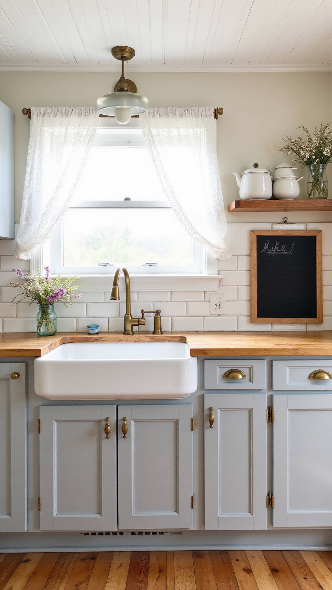 Cozy 10x10ft farmhouse kitchen with grey beadboard cabinets, butcher block countertops, white subway tile backsplash, farmhouse sink, and vintage decor in soft greys, creamy whites, and honey wood tones.
