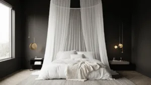 "Elegant modern minimalist black and white bedroom with canopy bed, white linens, textured throws, and golden light streaming in."